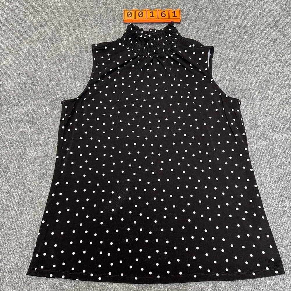 Adrianna Papell black with white polka dot blouse in size Small.